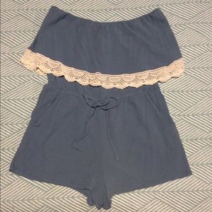 Sleeveless romper with lace ruffle